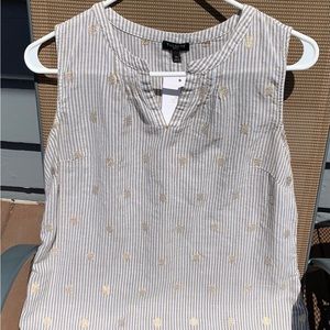 Sleeveless light weight top with metallic flowers